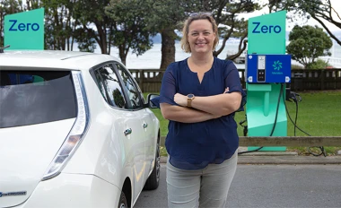 A person with a Nissan Leaf at Zero charging station